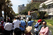 Scores of people stand outside Durban's Addington Hospital in December 2020. File photo.