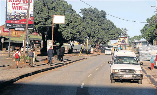 It is business as usual on Ngcobo’s main street during the day but at night not so, when it becomes pitch dark as there are no street lights. Picture: LULAMILE FENI