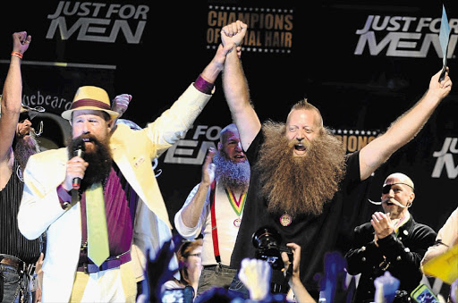 GROW WEST: Phil Olsen announces a winner at this year's Annual Beard and Moustache Championships in New Orleans