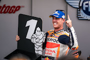 Pol Espargaro shows the number one board at parc ferme during the qualifying session of the MotoGP Monster Energy British Grand Prix at Silverstone Circuit on August 28, 2021 in Northampton, England.