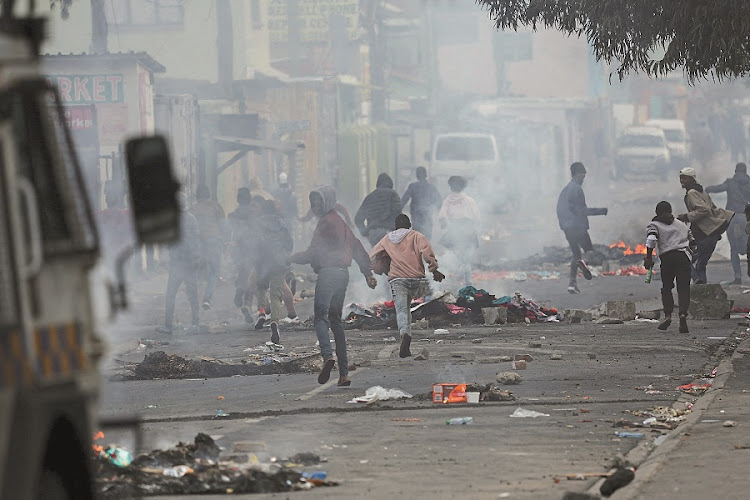 A city on edge: A violent strike against Cape Town’s bylaws left commuters stranded earlier this month. Picture: Reuters/Esa Alexander