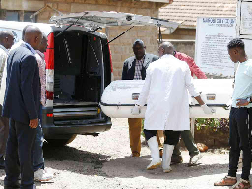Relatives watch as the body of Mildred Odira is being moved from the City Motuary to Lee Funeral Home after the postmortem was conducted yesterday.Photo/Jack Owuor
