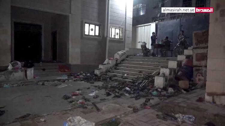 Abandoned footwear and other belongings lie on the ground after a stampede in Sanaa, Yemen, April 19, 2023, in this still image taken from video. Picture: AL MASIRAH TV/VIA REUTERS