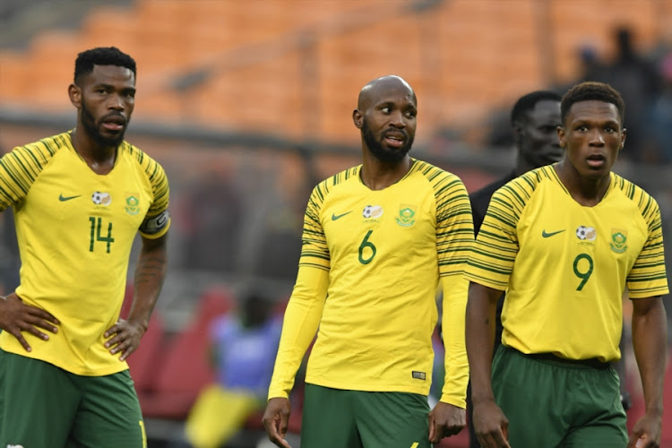 Bafana Bafana captain Thulani Hlatshwayo (L), right-back Ramahlwe Mphahlele (C) and strker Lebo Mothiba (9) look on during the 2019 Africa Cup of Nations qualification match between South Africa and Seychelles at FNB Stadium on October 13, 2018 in Johannesburg.