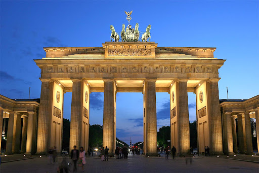 The Brandenburg Gate in the Moabit section of Berlin is a former city gate, rebuilt in the late 1700s as a neoclassical triumphal arch.