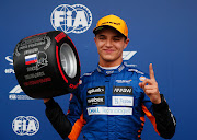 Lando Norris celebrates in parc ferme after qualifying P1 for the F1 Grand Prix of Russia at Sochi Autodrom on September 25, 2021 in Sochi, Russia.