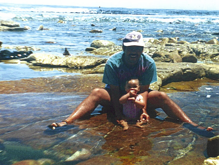 Michael Solomon, the man Miche grew up knowing as a her father at the beach with her when she was eight-months-old.