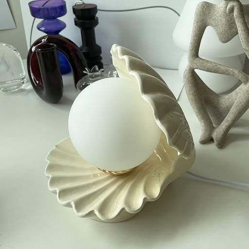 Title 4, Shell Ceramic Table Lamp provides elegant light...