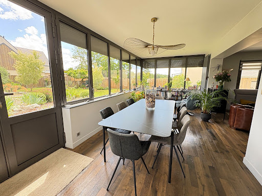 Dining room with table, chairs, garden in this luxury property for sale in Amboise ($593,232 - 135 m²)