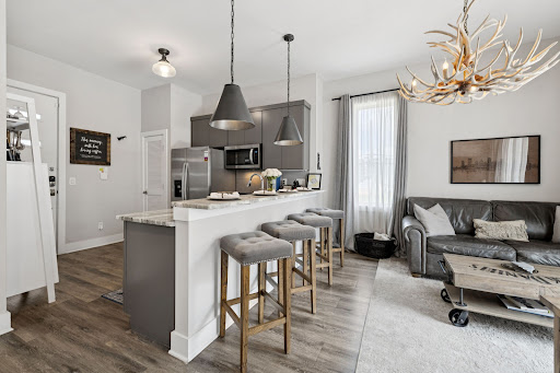Modern kitchen with island and bar stools in this luxury house for sale in Nashville ($385,000)