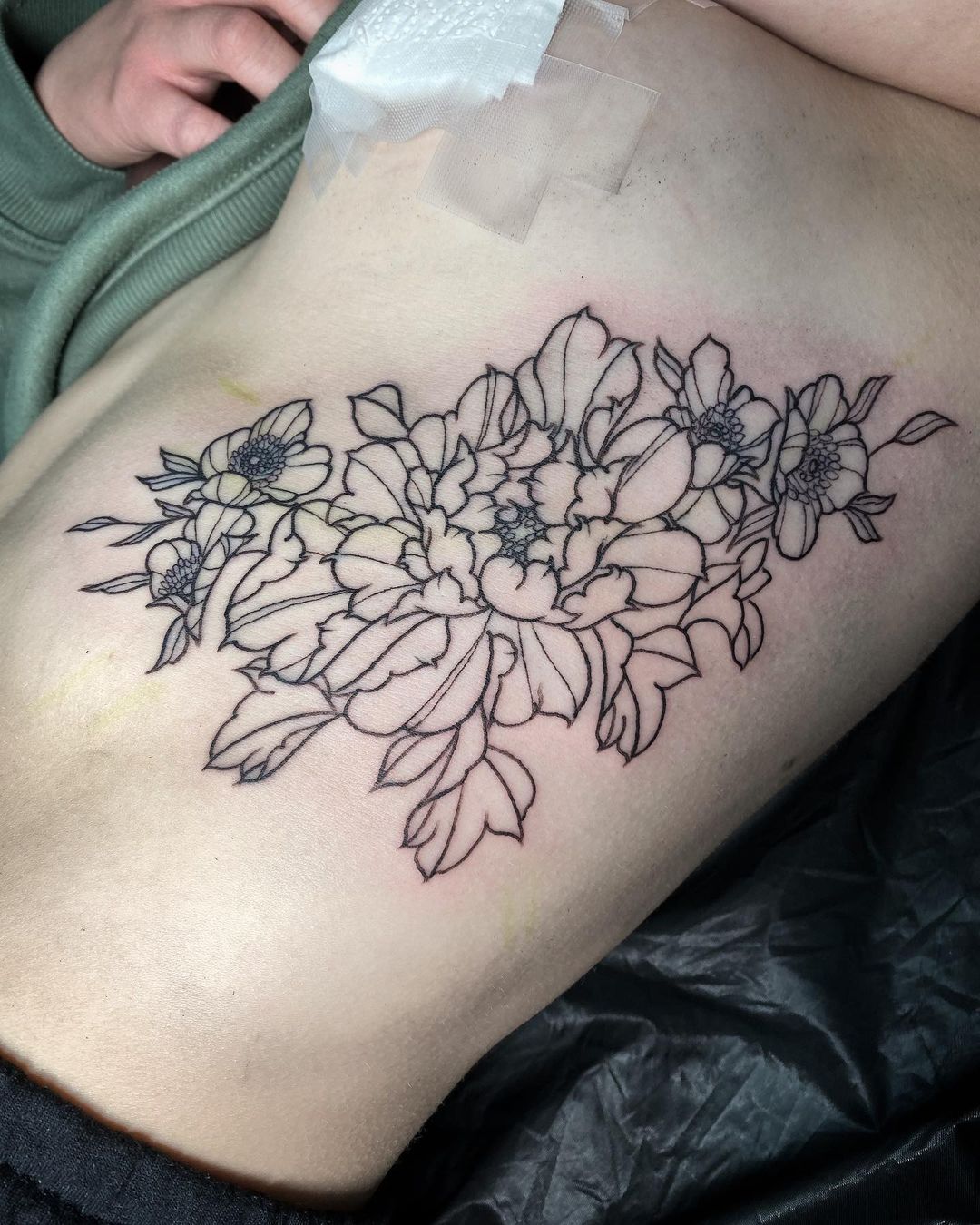 outlined flower tattoo