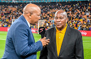 Kaizer Chiefs chairman Kaizer Motaung is interbiewed during an Absa Premiership match at FNB Stadium. 