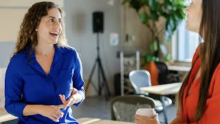 A lady is having coffee with a colleague