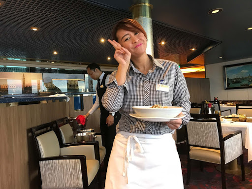 Don't forget to thank your wait staff (like Ajeng on ms Oosterdam, above) during your sailing.