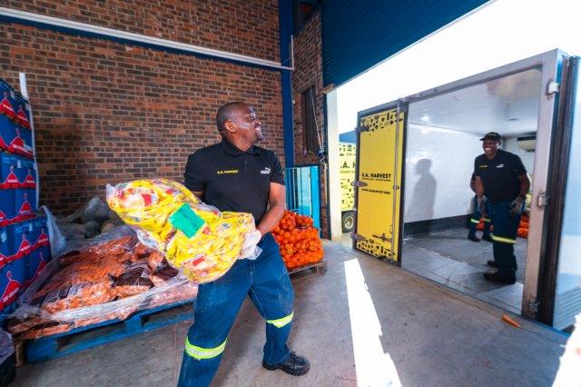 A SA Harvest team unloads donated items.