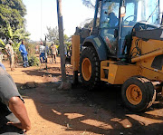 Soldiers help the Nkomazi municipal officials to  reopen a water pipe that was blocked  by a local. / MANDLA KHOZA