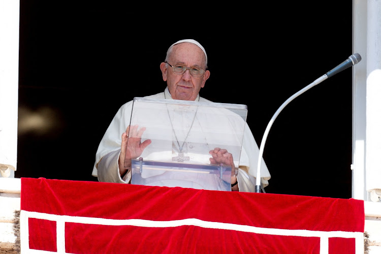 Pope Francis leads the Angelus prayer from his window at the Vatican, October 2 2022.