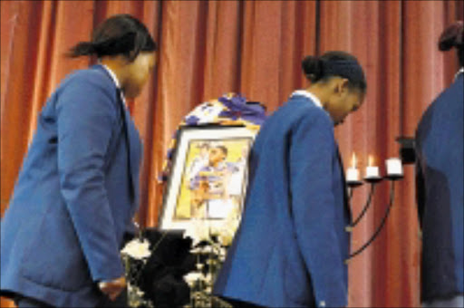 SAD FAREWELL: Schoolmates at the memorial service of schoolboy Uhuru Joyi. 26/03/09. Pic. Mohau Mofokeng. © Sowetan.