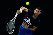 Novak Djokovic of Serbia serves during a practice session ahead of the 2022 Australian Open at Melbourne Park on January 14 2022.