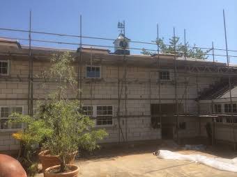 New slate roof on new build and annex including mounting clock-tower album cover