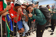 Bafana Bafana star Teboho Mokoena during the national team's arrival at OR Tambo International Airport in Johannesburg on Wednesday after wining the bronze medal at the Africa Cup of Nations in Ivory Coast.