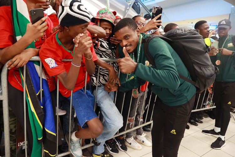 Bafana Bafana star Teboho Mokoena during the national team's arrival at OR Tambo International Airport in Johannesburg on Wednesday after wining the bronze medal at the Africa Cup of Nations in Ivory Coast.
