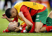 Sofyan Amrabat of Morocco (below) after their World Cup quarterfinal win against Portugal at Al Thumama Stadium on December 10 2022. Morocco meet France in Wednesday's semifinal.