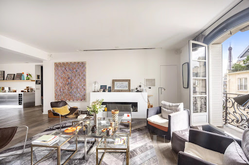 Luxury property for sale in Paris 16ème (75016) - Modern living room with fireplace and Paris view