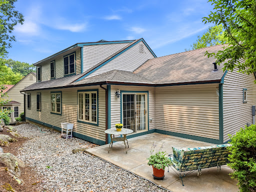 Rear of house with patio and garden - Apartment / penthouse purchase in East Lyme, 4 bedrooms