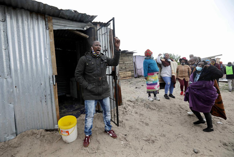 Bulelani Qholani, the man who was violently evicted by Cape Town police while he was naked in his shack, held a demonstration with community members.