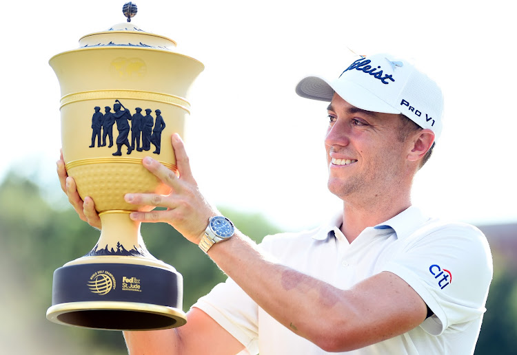 Justin Thomas poses with the World Golf Championships trophy after winning the WGC at the FedEx St. Jude Invitational golf tournament at TPC Southwind in Memphis on August 2, 2020.