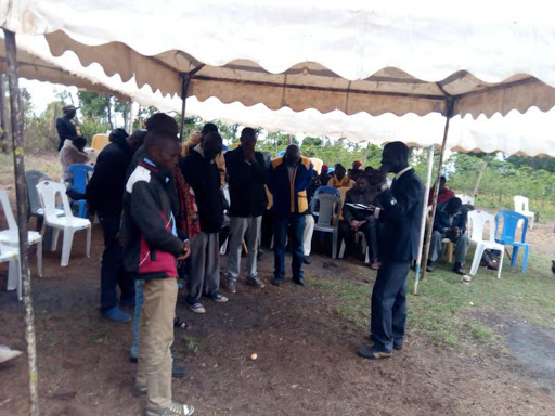 Mourners bow to pray after burial of Ex-Kakamega DC Paul Yatich’s slain wife Loise which was snubbed after court injunction at her marital home in Talai, Baringo central Sub-county on Wednesday. /JOSEPH KANGOGO