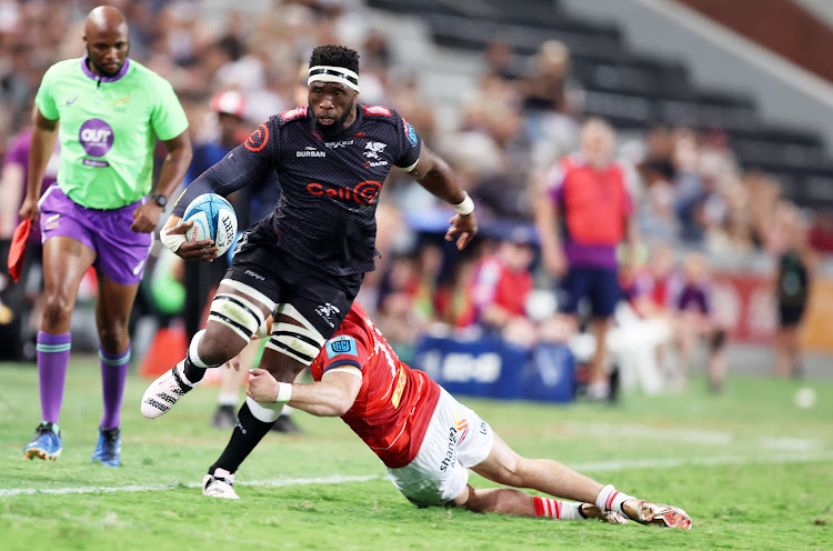 Shane Daly of Munster tackles Siya Kolisi of the Sharks in their United Rugby Championship clash at Kings Park on Saturday. Picture: Steve Haag Sports/INPHO/Shutterstock/BackpagePix