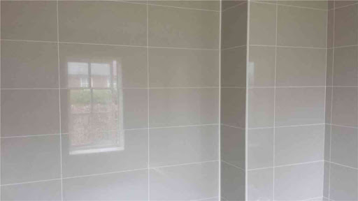 Tiling an en suite bathroom.