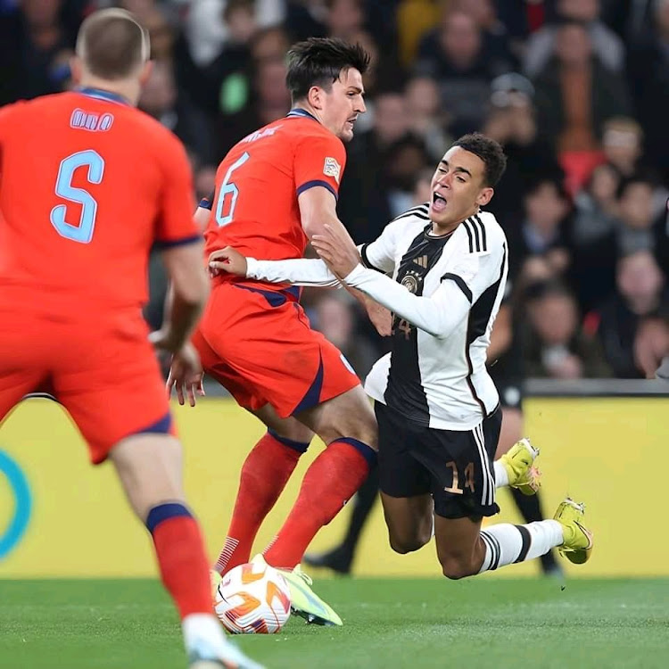 England defender Harry Maguire in action against Germany's Jamal Musiala