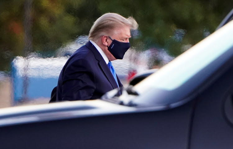 U.S. President Donald Trump arrives at Walter Reed National Military Medical Center by helicopter after the White House announced that he "will be working from the presidential offices at Walter Reed for the next few days" after testing positive for the coronavirus disease (COVID-19), in Bethesda, Maryland, U.S., October 2, 2020.