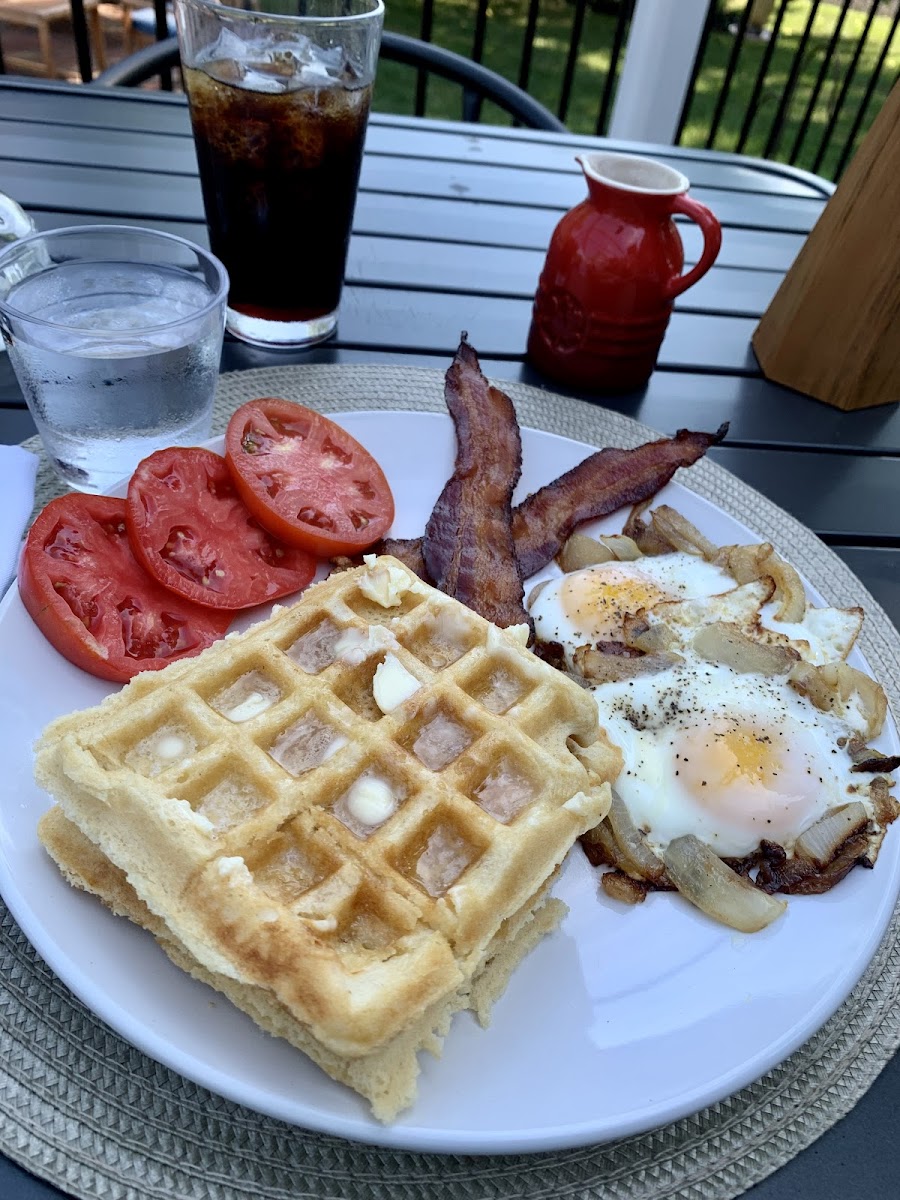 Gluten free waffles, bacon, carmelized onion and egg smash, and heirloom tomatoes