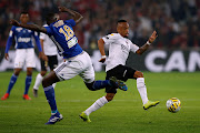 Strasbourg's Ibrahima Sissoko in action with Guingamp's South African forward Lebogang Phiri (R) during Coupe de La Ligue Final match in France in March 2019.