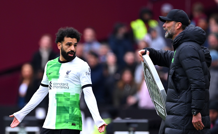 Mohamed Salah of Liverpool clashes with manager Jurgen Klopp during the Premier League match against West Ham United at London Stadium on Saturday. Picture: JUSTIN SETTERFIELD/GETTY IMAGES