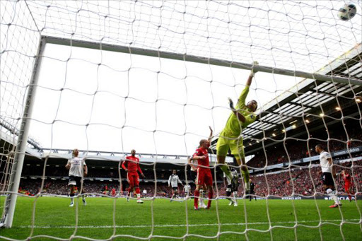 Tottenham goalkeeper Carlo Cudicini tips the ball over his crossbar during the Barclays Premier League match between Liverpool and Tottenham Hotspur at Anfield on May 15, 2011 in Liverpool, England