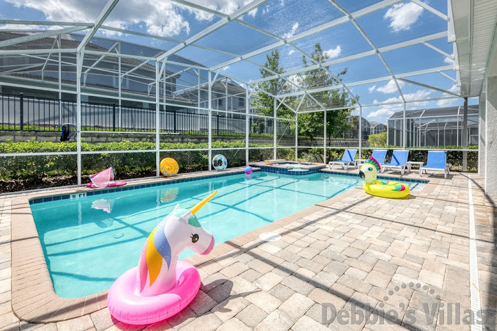 Sun-drenched west-facing pool and spa deck at this Davenport vacation villa