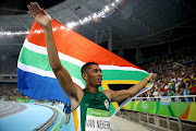 Wayde van Niekerk of South Africa reacts after winning the Men's 400 meter final on Day 9 of the Rio 2016 Olympic Games at the Olympic Stadium on August 14, 2016 in Rio de Janeiro, Brazil.  (Photo by Cameron Spencer/Getty Images)