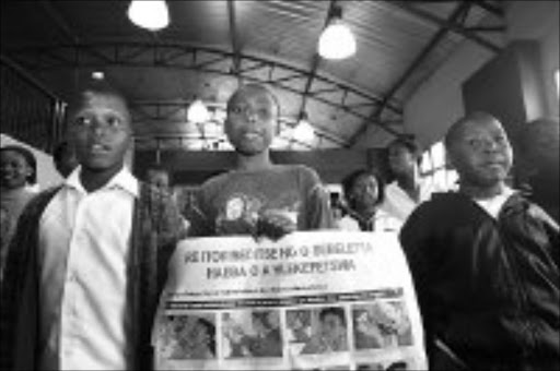 SENSITIZING: Pupils from Shamonani Primary School in Dube, during the 16 days of Activixm against Women and Children Abuse in Soweto. Pic. Antonio Muchave. 26/11/07. © Sowetan.