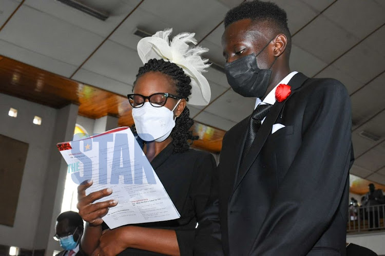 The late Lawyer Evans Monari's wife Jacqueline Monari and Son Jeremy Monari during his memorial service at SDA Church, Nairobi on October 14, 2021. PHOTO/MERCY MUMO