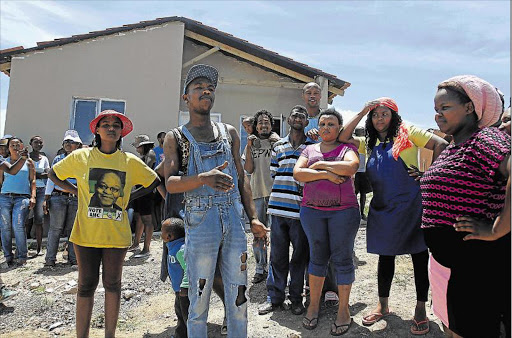 TAKING A STAND: Some of the unemployed youth in NU 3 Mdantsane who disrupted construction, demanding employment on the re-gravelling project in their community Picture: SIBONGILE NGALWA