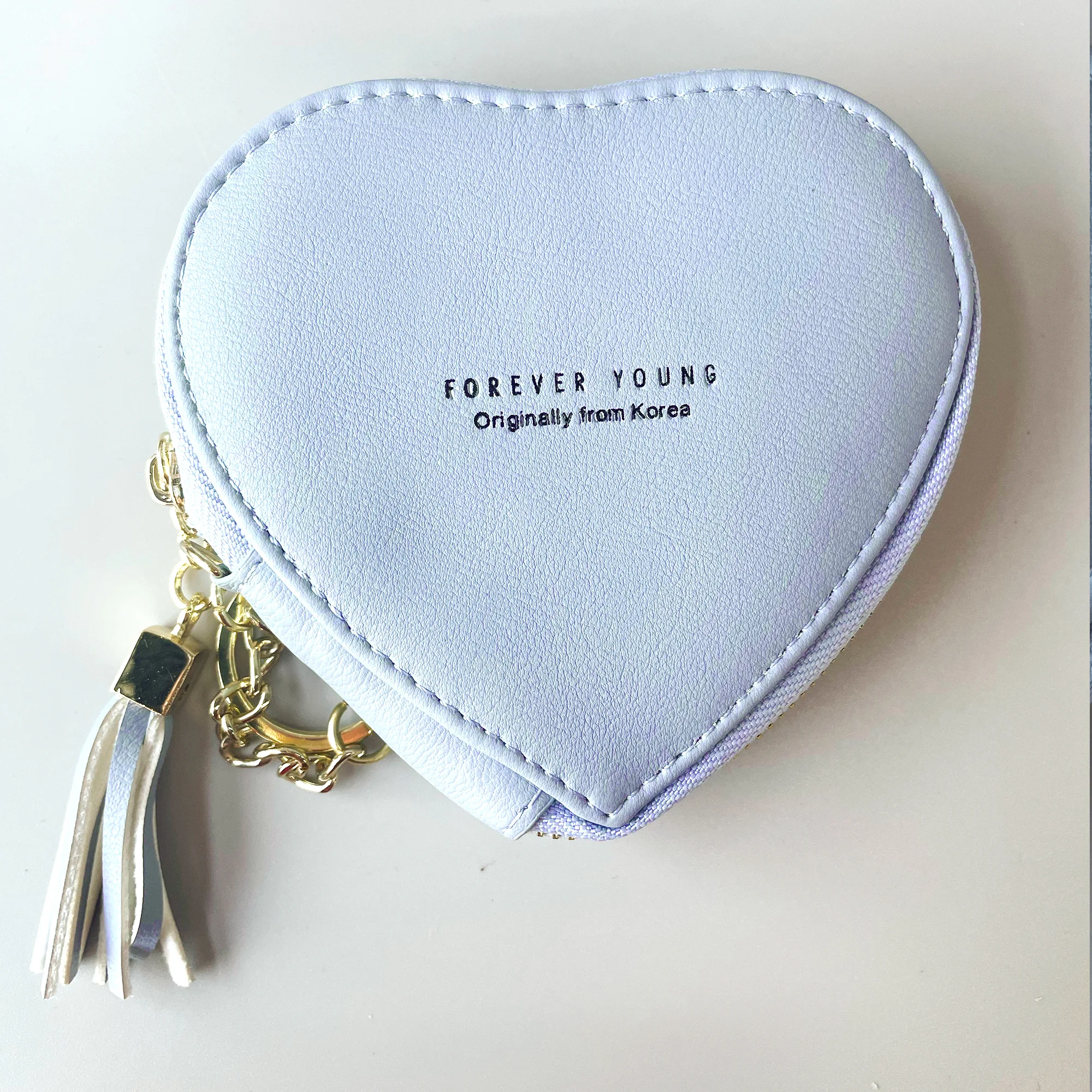 Title 4, Haarbal-lippenstift-tas, armband, sleutelhanger...