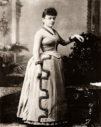 19th century woman in a bustle skirt.