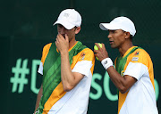 Raven Klaasen (Right) and Jean Andersen of South Africa discuss tactics during the Doubles match of the Davis Cup tie between South Africa and Lithuania at the Irene Country Club on April 05, 2014 in Pretoria, South Africa.