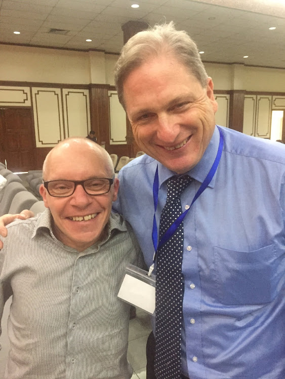 Australian economist Sean Turnell stands with fellow economist Tim Harcourt during the Australia Myanmar Institute conference at Yangon University in Yangon, Myanmar November 2017 2022 in this picture obtained from social media. Picture: REUTERS/TIM HARCOURT