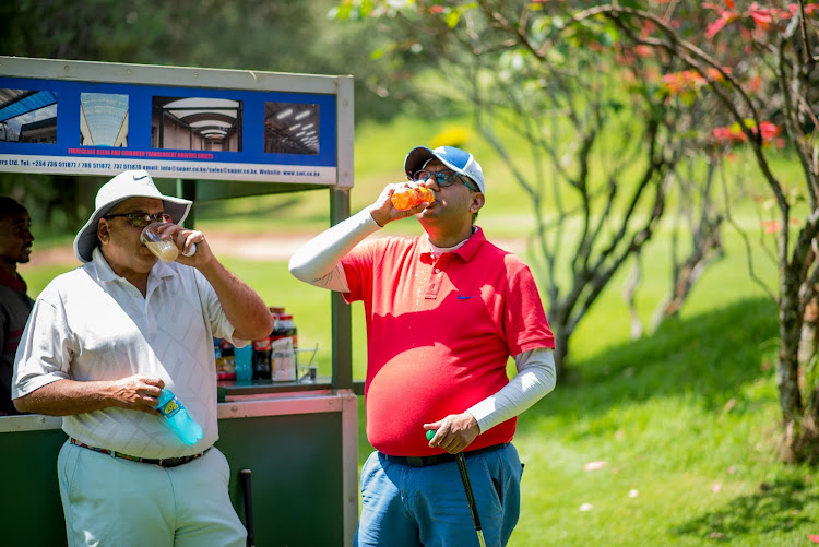 Former Sigona Golf Club Chairman and Ex-Captain Rajiv Medirata with BIDCO Africa’s Credit Control Head Sagar Dodhia at the hydration point during BIDCO Africa Golf Day at SIGONA Golf Club on Saturday, May 21, 2022.